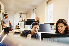 people working in an office boardroom