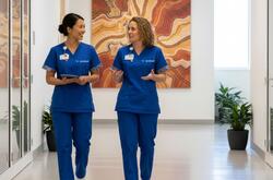 an image of two nurses walking