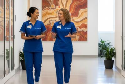 an image of two nurses walking