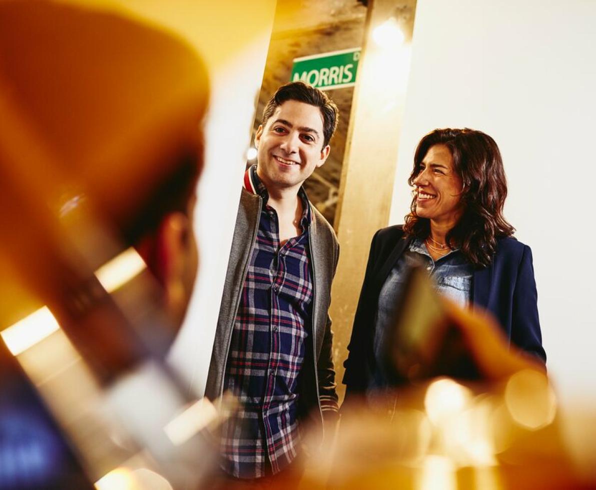 A photo of a man and a woman having a conversation