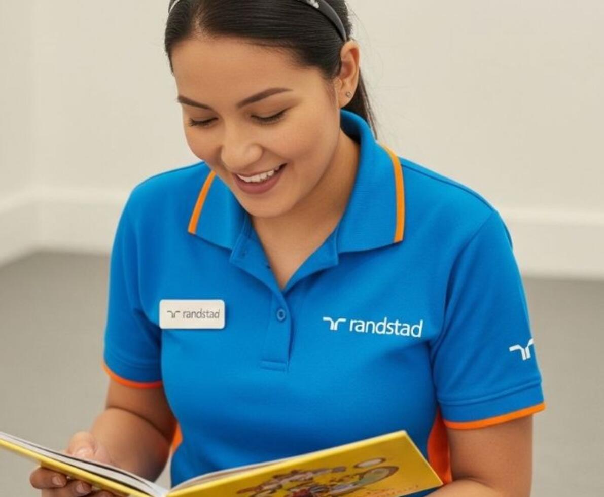 image of a randstad educator reading a book in an early childhood setting