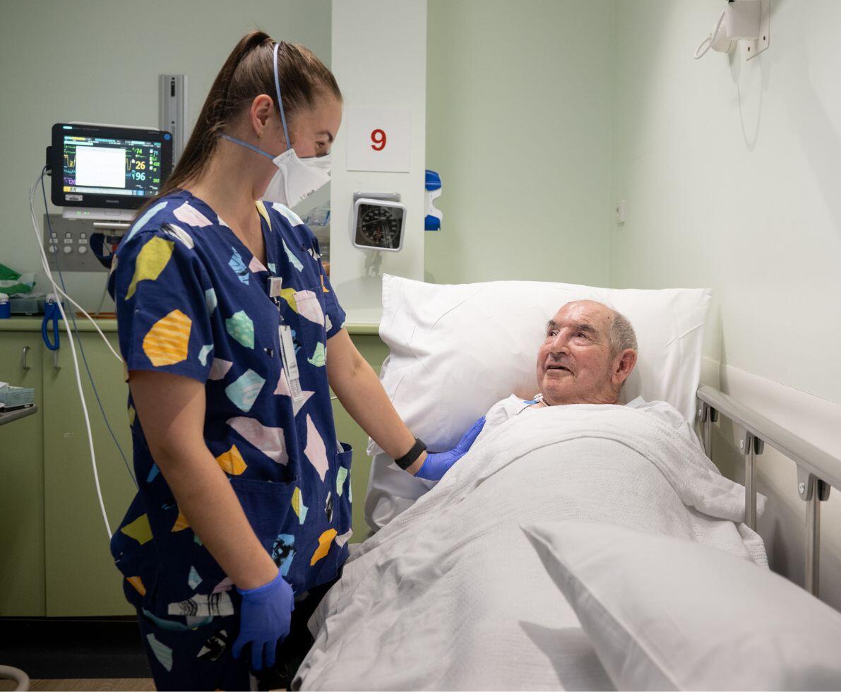 image of a healthcare professional in a hospital setting caring for a patient