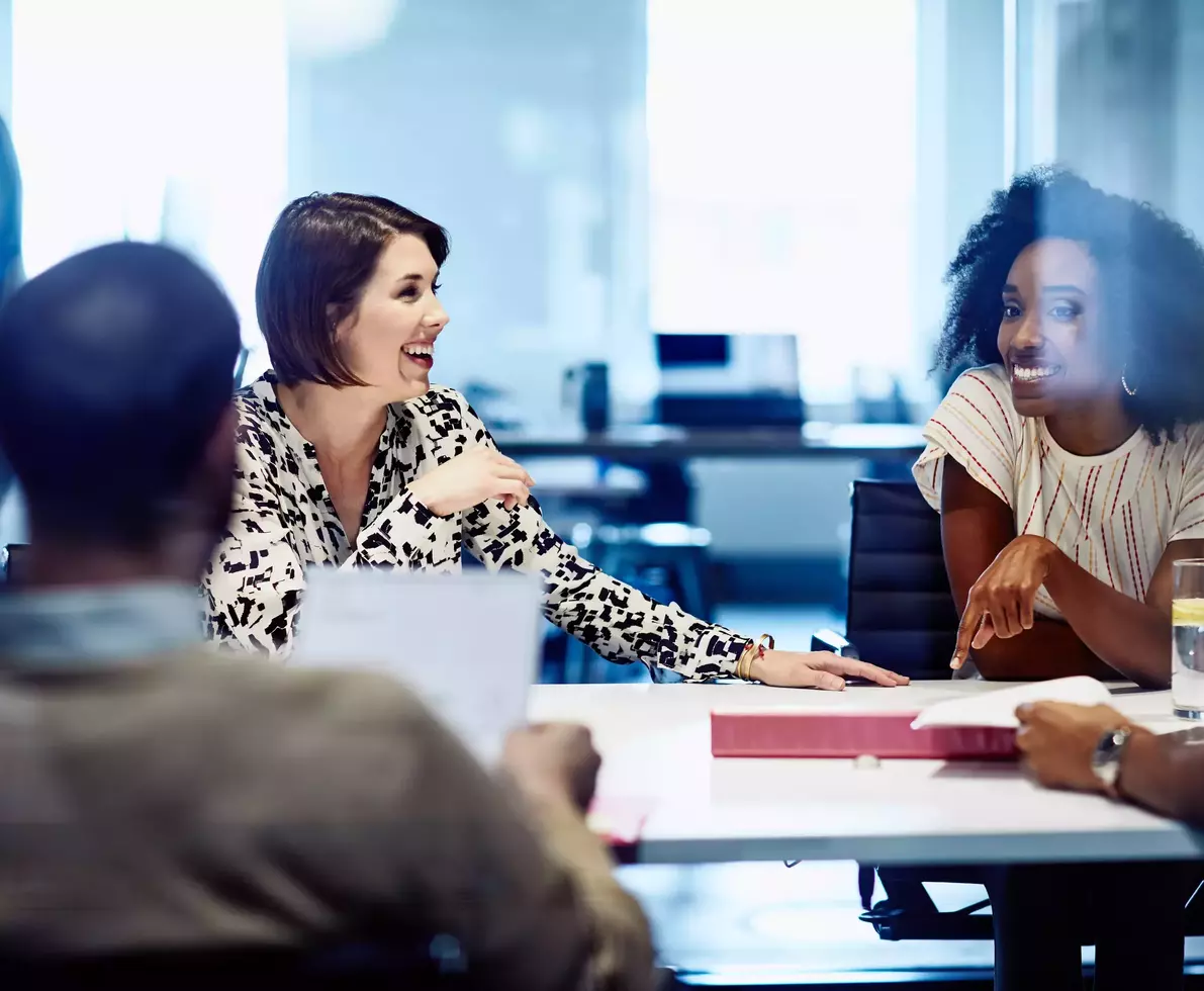 Smiling female in meeting at the office.