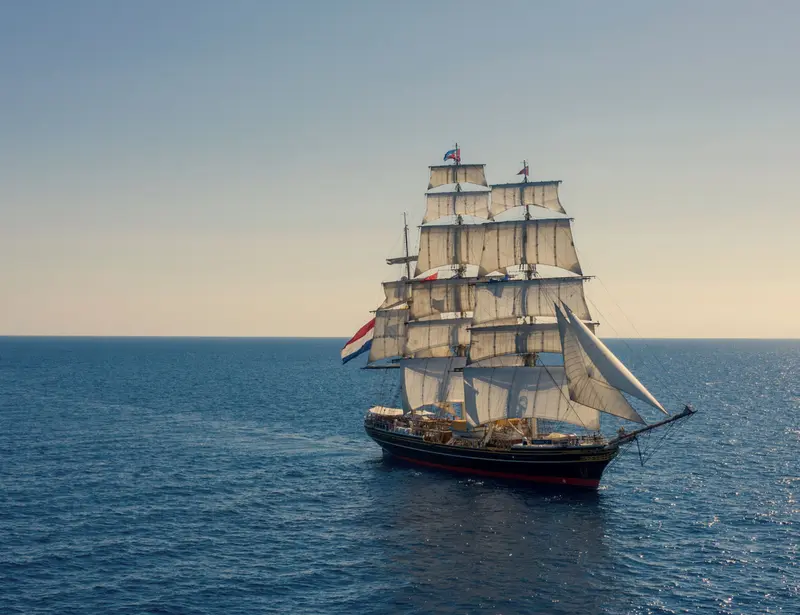 randstad clipper sailing on sea into the sunset