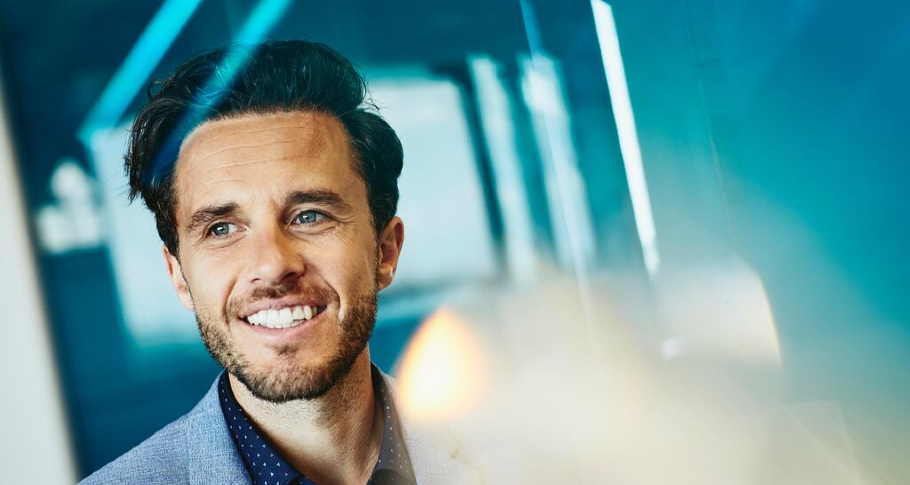 Close up - Smiling man looking away.