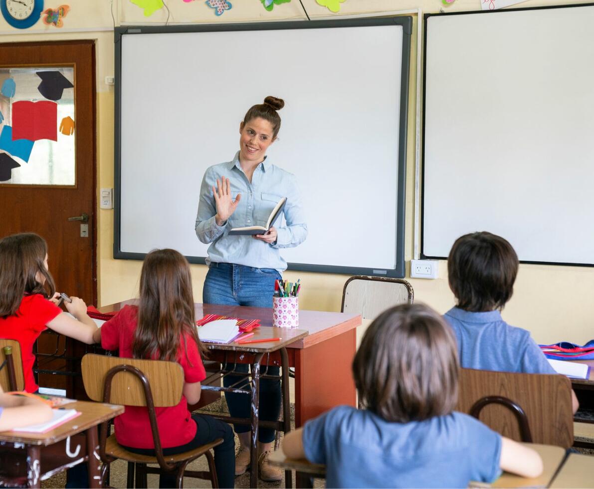 an image of a woman teaching young kids an image of a woman teaching young kids