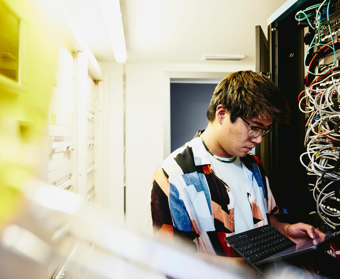 A man working with a device
